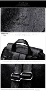 Detail of black litchi grain leather backpack with embossed logo and adjustable strap