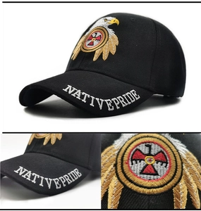 Detail of Native Pride embroidery and eagle totem on black cotton baseball cap