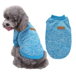 Blue knit dog sweater with leather tag detail showing textured fabric and fit