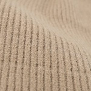 Beige thick ribbed knit winter hat for women featuring warm jacquard texture and stretch