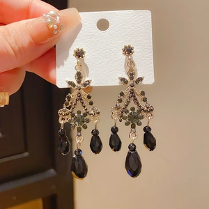 Detail of vintage chandelier earrings featuring black crystals and 925 silver needles