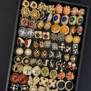 Collection of vintage gold-tone flower earrings with pearls and colorful gemstones
