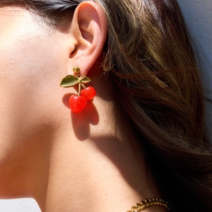 18K gold stainless steel cherry earrings worn by model in a stylish close-up shot