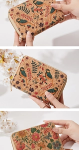 Detail of cork wallet featuring colorful bird and floral patterns with zipper closure