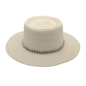Detail of cream straw boater hat featuring a stylish silver metal curb chain decoration