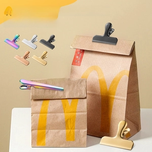 Colorful stainless steel food sealing clips in rainbow, gold, and silver for snack bags