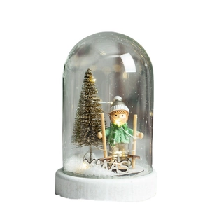 Christmas glass dome decoration with golden tree, skiing figure and LED fairy lights