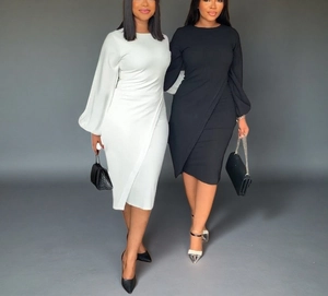 Detailed view of long lantern sleeves and waist pleats on elegant black and white dresses
