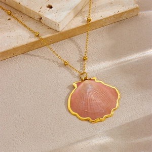 Detail of pink seashell pendant with gold edge and beaded stainless steel chain