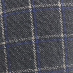 Macro shot of plaid tweed fabric in grey and blue with detailed wool blend textures