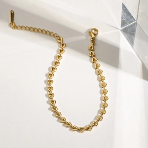 Elegant gold hollow heart-shaped link stainless steel bracelet with lobster clasp