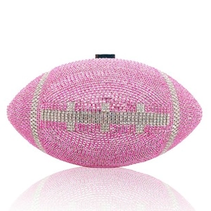Detailed shot of pink rugby ball-shaped clutch encrusted with sparkling crystals