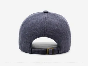 Detail view of the washed dark gray baseball cap showing the adjustable metal buckle strap