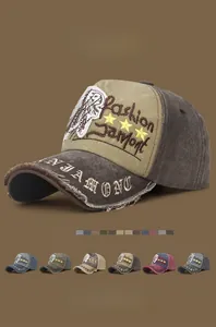 Detail of vintage washed cotton baseball cap with Jamont embroidery and distressed frayed edges