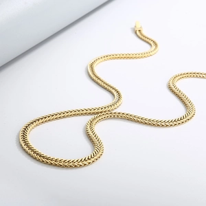Detailed view of a gold stainless steel curb chain necklace with a secure lobster clasp
