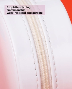 Close-up of durable zipper and fine stitching on high-end round jewelry box