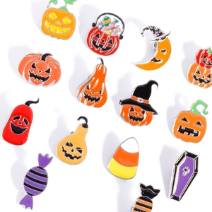 Halloween enamel pin set featuring pumpkin lantern and wizard hat badges in orange and purple
