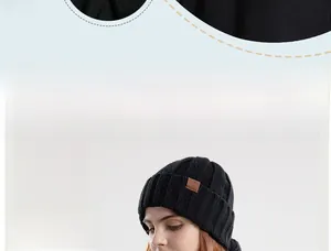 Detail of black winter knitted hat showing the thick thermal plush lining and texture