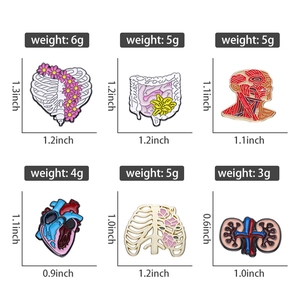 Macro detail of six anatomical enamel pins with precise dimensions and gut design