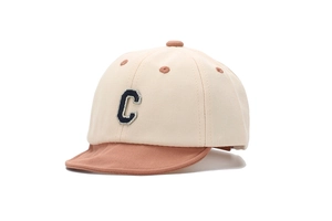 Detail of baby baseball cap with pink brim and navy blue letter C embroidery