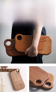 Detail of round smooth edges and polished finish on solid ebony wood cutting boards