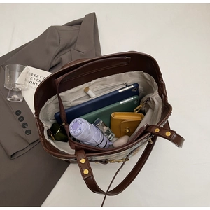 Top view of large capacity vintage tote bag interior showing storage space for daily items