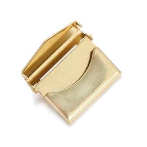 Detailed view of an open gold-plated rectangular locket pendant with internal hinge structure