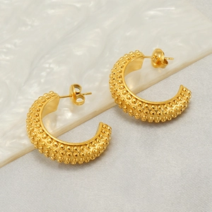 Minimalist gold-plated C-shaped stainless steel earrings with textured bead surface