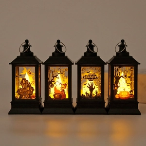 Four Halloween LED lanterns with orange glow featuring witch, pumpkin and ghost designs