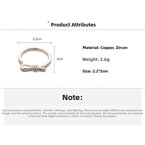 Detailed view of silver bow ring with zircon stones including size and weight measurements