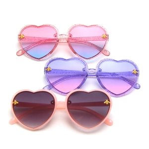 Kids heart shaped sunglasses with glitter frames and gold bee accents in multiple colors
