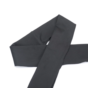 Detailed view of the black fabric strap with precise double-edge stitching and texture