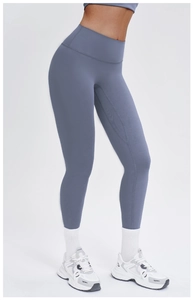 Detail of high-waisted yoga leggings in dusty blue with elastic performance fabric
