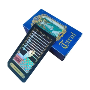 Detail view of 9 of Swords card and blue Tarot card box with High Priestess illustration