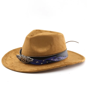 Detail of brown suede cowboy hat featuring leather band with wing emblem and silver stars