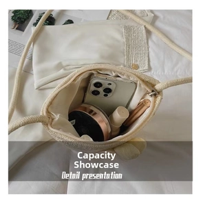 Internal storage view of mini woven shell bag showing space for phone and makeup