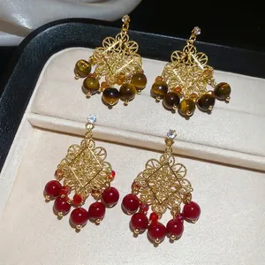 Floral tiger eye and red stone drop earrings with gold filigree and crystals