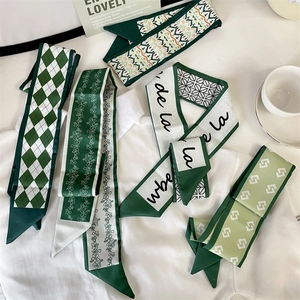 Set of five elegant green and white silk scarves with floral and geometric patterns