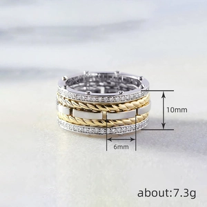 Two-tone silver and gold layered wide ring with twisted cable design and pave zircons