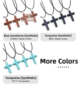 Details of 40mm natural crystal cross pendants in goldstone, blue sand, and turquoise