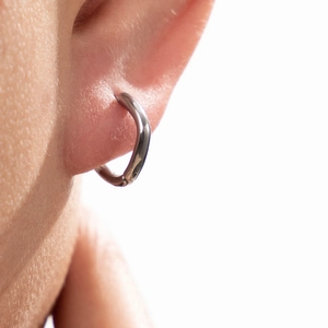 Retro titanium steel twisted hoop earring for men and women in polished silver finish