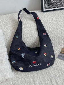 Denim crossbody bag with colorful cartoon embroidery and white SOZAKKA lettering
