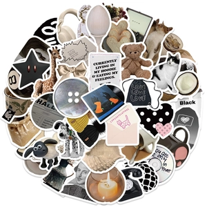 Macro detail of 60pcs creative black and white stickers with cute bears and coffee motifs