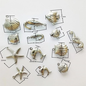 Macro view of stainless steel ocean pendants with precise size measurements in mm