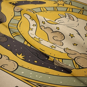 Macro shot showing high-density fabric texture and cute sleeping cat printed pattern