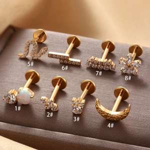 Set of 8 gold titanium ear studs with micro-inset zircons in various geometric shapes