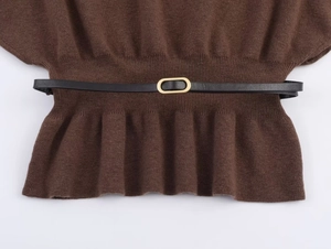 Detail of dark brown knit top featuring a ribbed waist and black belt with gold buckle