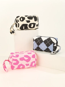 Three canvas cosmetic bags featuring leopard print and checkerboard patterns with top handles