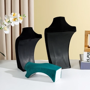 Portrait bust necklace display stands in black and green velvet for jewelry storage