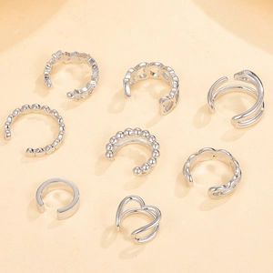 Detailed view of 8-piece silver ear cuff set with 925 hallmarks on various geometric designs